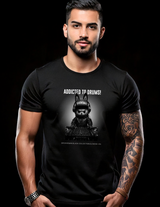 Man wearing a black t-shirt with a graphic design and text on a black background