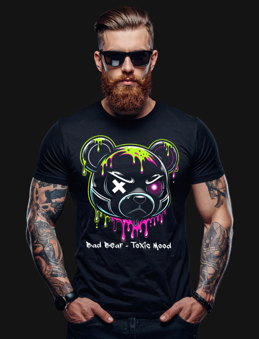 Man wearing a black t-shirt with a colorful graphic design on a dark background