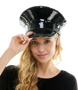 Woman wearing a black sequin hat on a white background