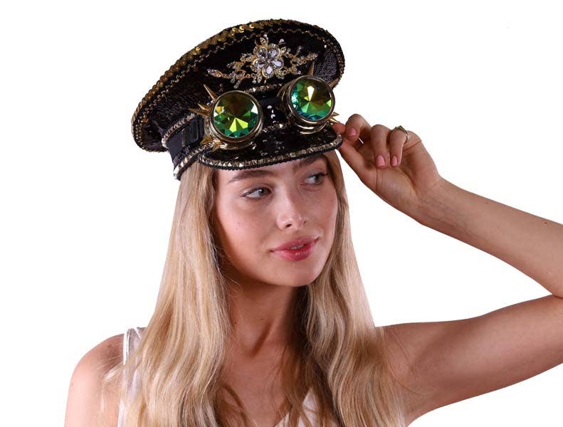 Woman wearing a decorative hat with goggles on a white background