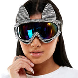 Person wearing sparkling goggles with a white background
