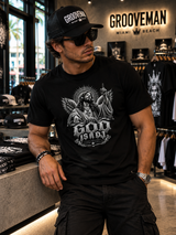 Close-up of God Is A DJ monochrome graphic with angel wings, halo, turntables and gothic typography on black cotton T-shirt