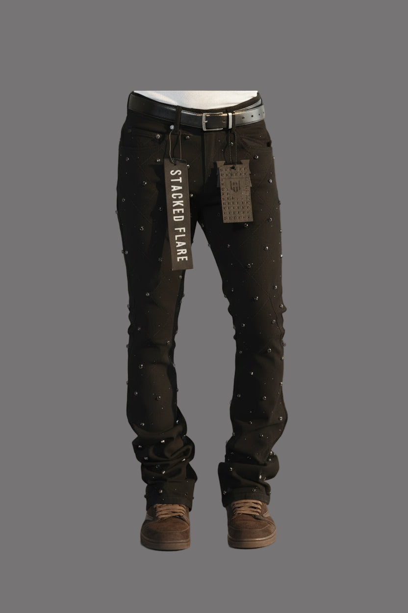 Black flared jeans with 'Stacked Flare' text on a white background