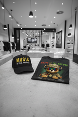 Black cap and t-shirt with bear graphic and text on a table in a store setting