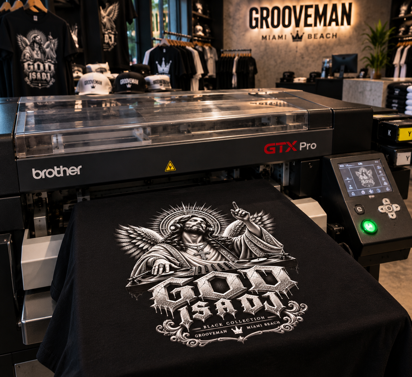 God Is A DJ graphic T-shirt being printed on a Brother GTX Pro DTG machine at Grooveman Music