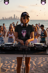 Black t-shirt with a cartoon character and text on a hanger against a dark background