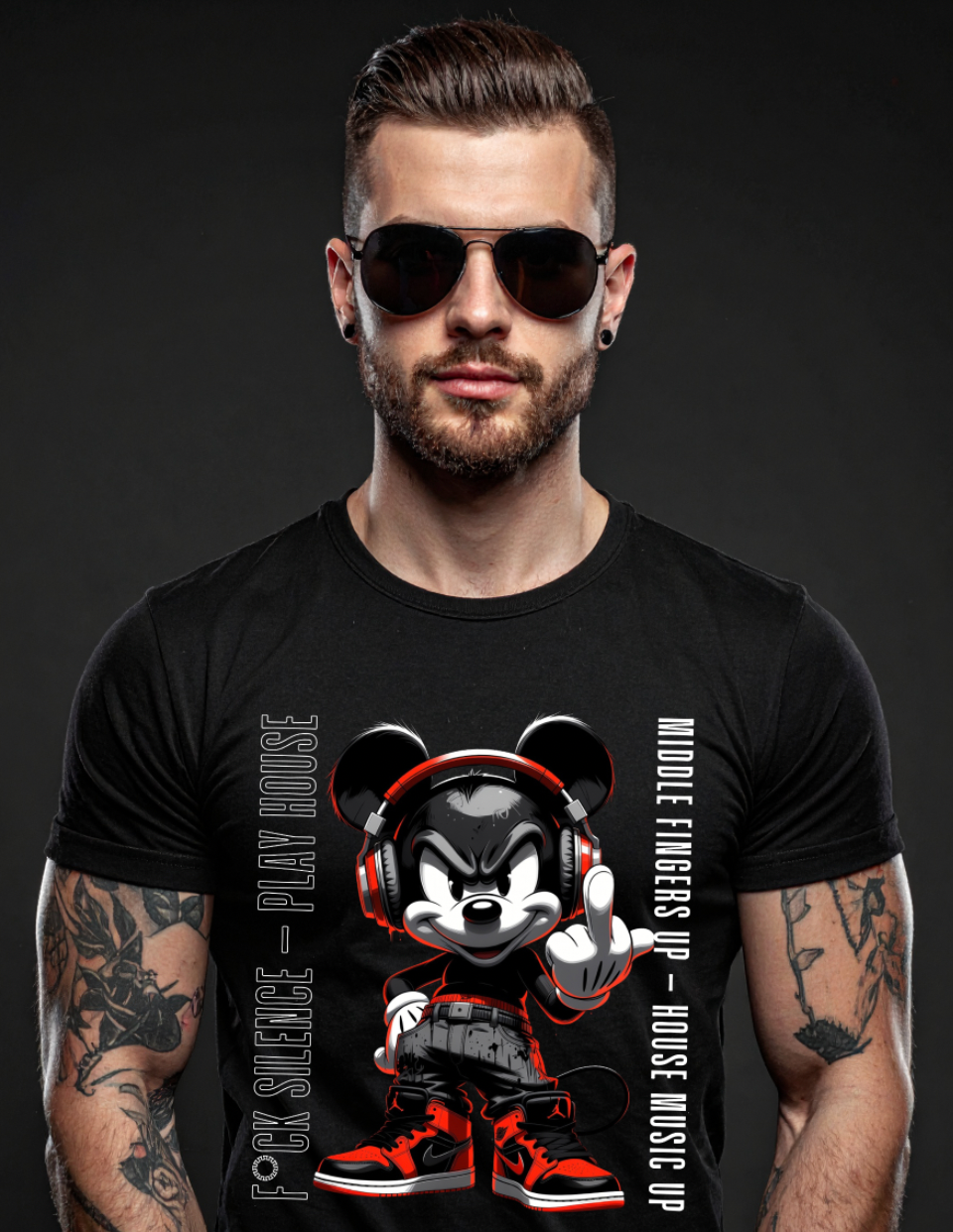Man wearing a black t-shirt with a graphic design of a character wearing headphones and sneakers on a dark background.