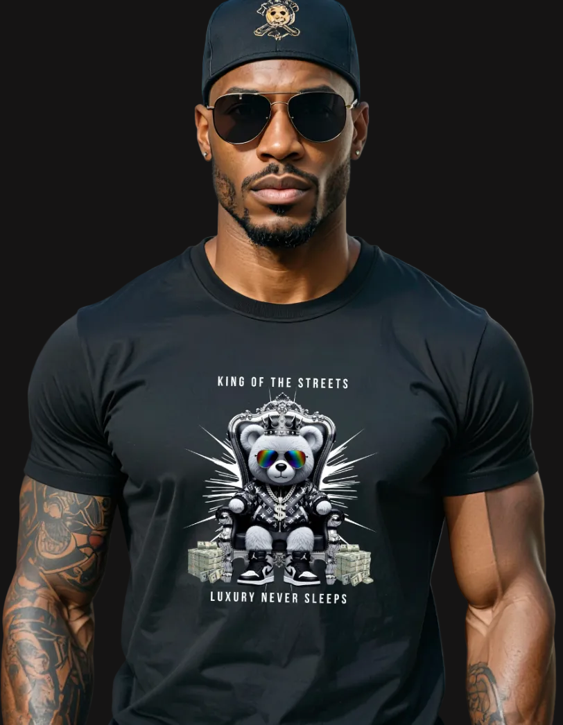 Man wearing a black t-shirt with a graphic design of a bear and text, standing on a city street.