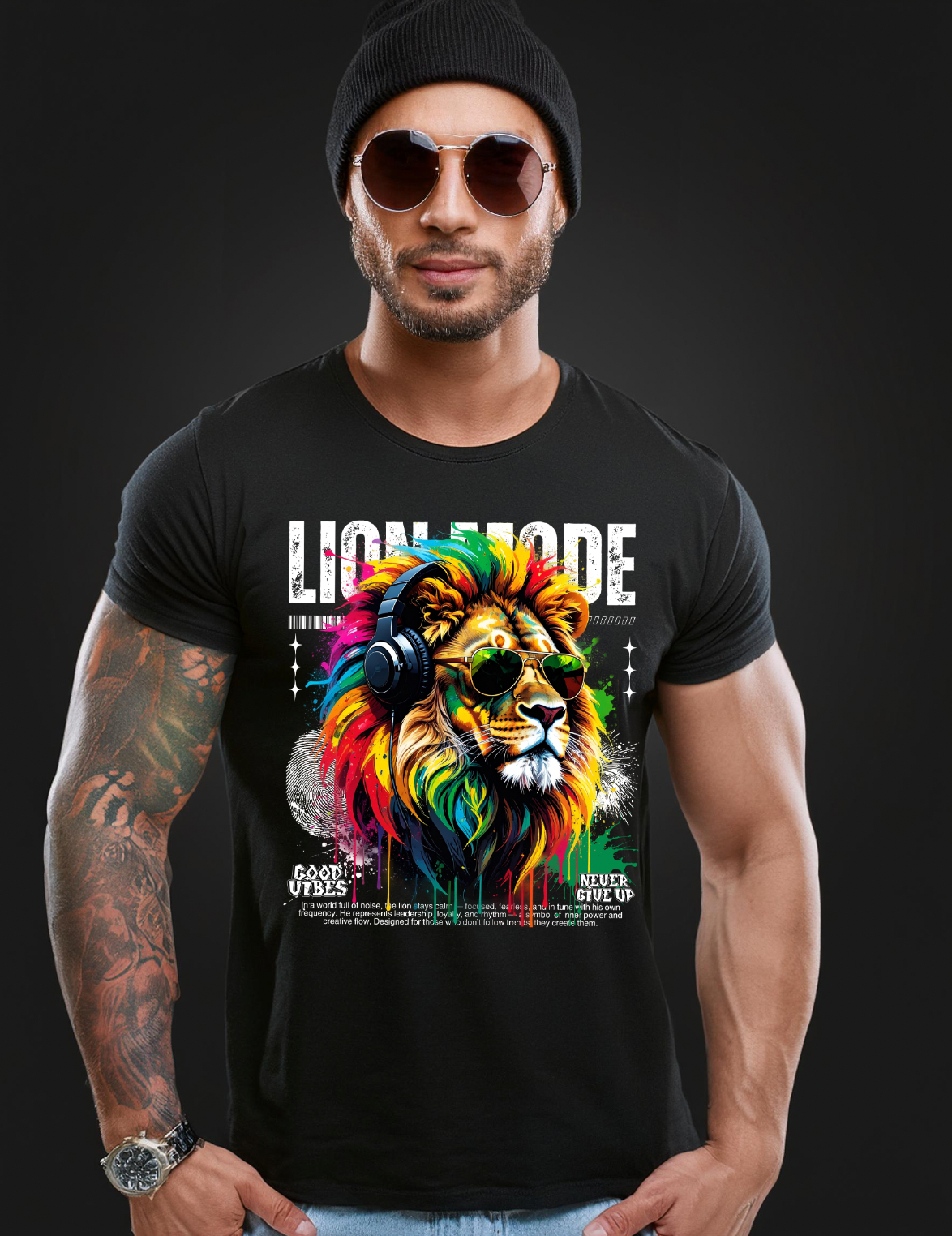 Man wearing a black t-shirt with a colorful lion graphic and text on a dark background