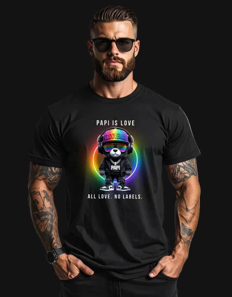 Man wearing a black t-shirt with a colorful graphic and text, standing against a plain background.