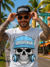 Man wearing a white t-shirt with a skull design and 'Grooveman' text, standing on a street with palm trees.