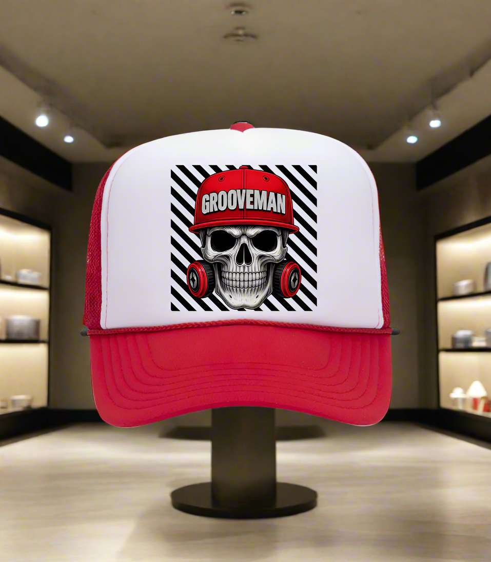 Trucker hat with skull design and 'Grooveman' text on a white background