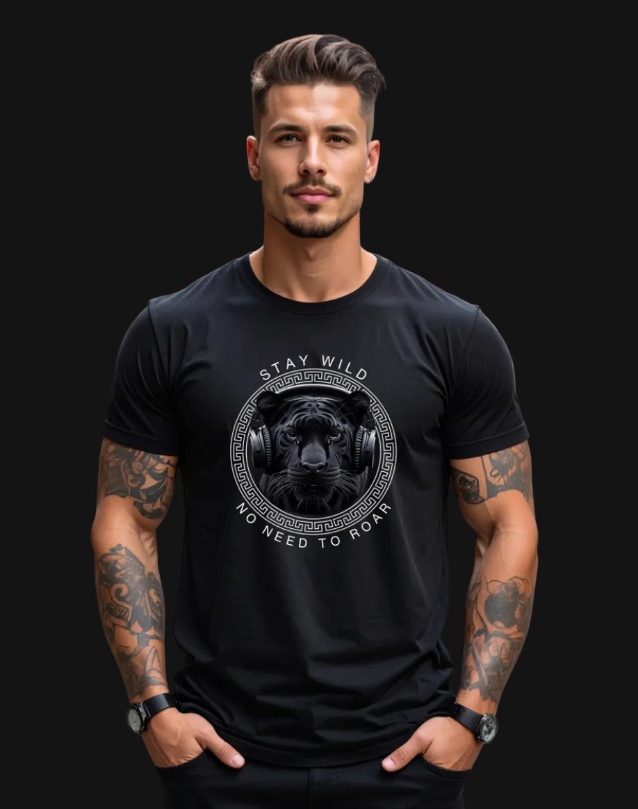 Man wearing a black t-shirt with a graphic design on a city street