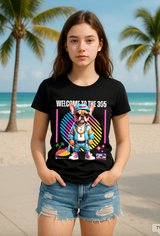 Person wearing a black t-shirt with colorful graphics and text on a beach.
