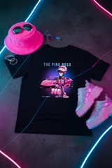 Black t-shirt with 'The Pink Boss' graphic design featuring a person in pink attire next to a pink car on a hanger against a dark background.