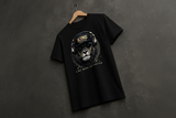 Black t-shirt with a lion graphic and text on a dark background