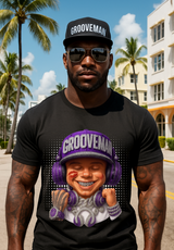 Person wearing a black t-shirt with a graphic of a person wearing a 'Grooveman' hat and sunglasses, standing outdoors with palm trees and buildings in the background.
