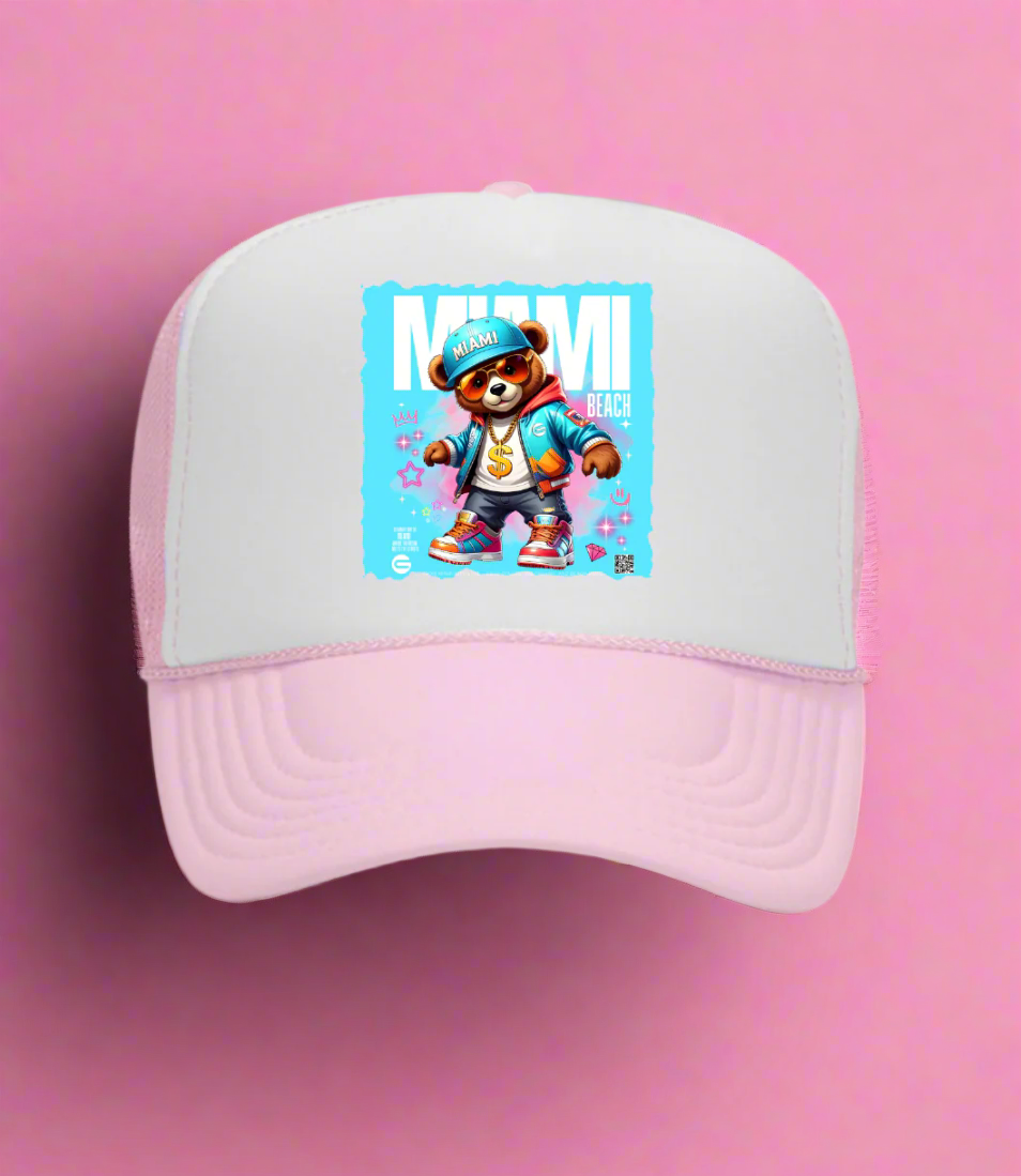Pink and white cap with a character design on a blue background