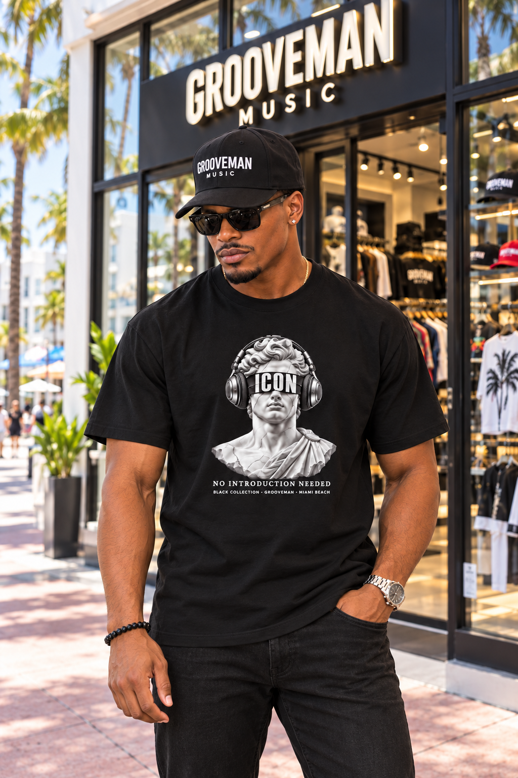 Model wearing the black ICON headphones graphic T-shirt from Grooveman’s Black Collection outside Grooveman Music in Miami Beach.