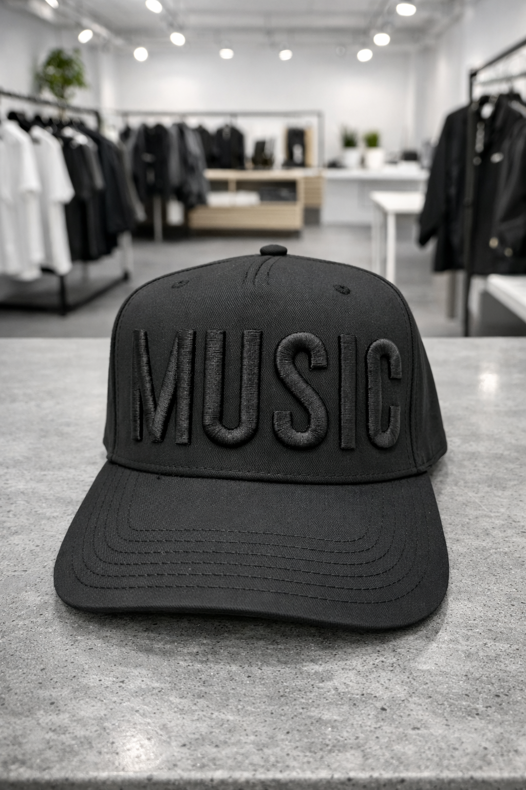 Black cap with 'MUSIC' text on a store floor