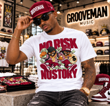 A man wearing a white t-shirt with a bold red and black graphic that reads 'NO RISK NO STORY' and two cartoon characters, paired with a matching red and black Grooveman cap, sitting inside a music store.