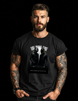 Man wearing a black t-shirt with graphic design and text