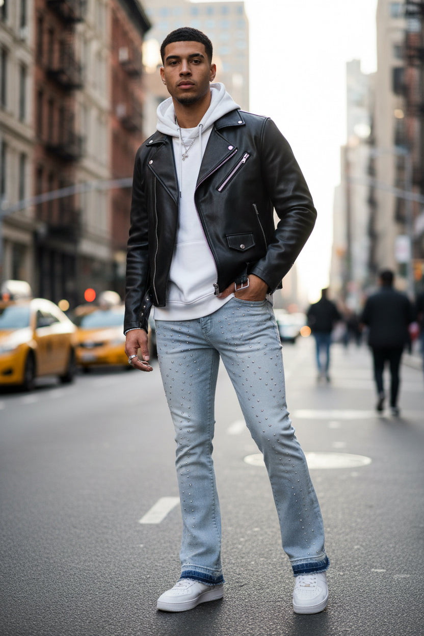 Light blue jeans with a tag on a white background