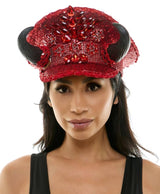 Red embellished cap worn by a model on a white background