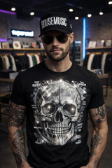 Man wearing a black t-shirt with a skull design and a cap in a store setting