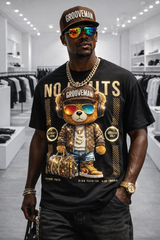 Person wearing a black t-shirt with a bear graphic and text in a store setting