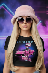Black t-shirt with 'The Pink Boss' graphic design featuring a person in pink attire next to a pink car on a hanger against a dark background.