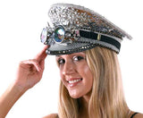 Woman wearing a decorative hat with gemstones on a white background