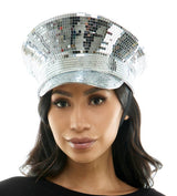 Person wearing a silver disco hat on a white background