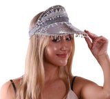Woman wearing a sparkling visor with a plain background