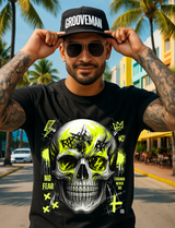 Man wearing a black t-shirt with a skull design and 'Grooveman' cap in a tropical setting.
