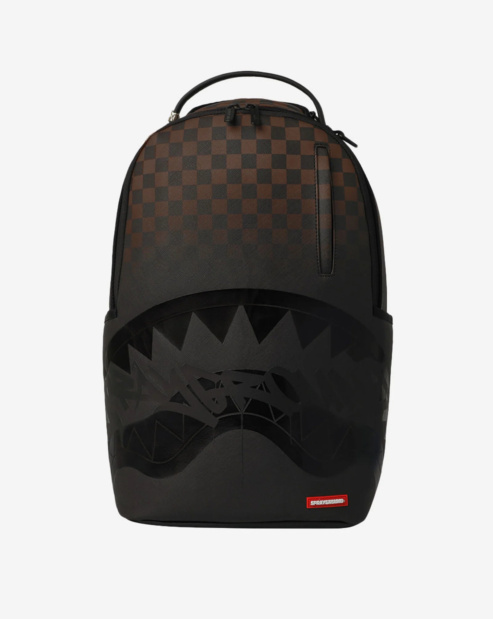 A Sprayground backpack in black and dark brown checkerboard pattern with a black shark face graphic on the front and a small red Spraycraft logo tag at the bottom.