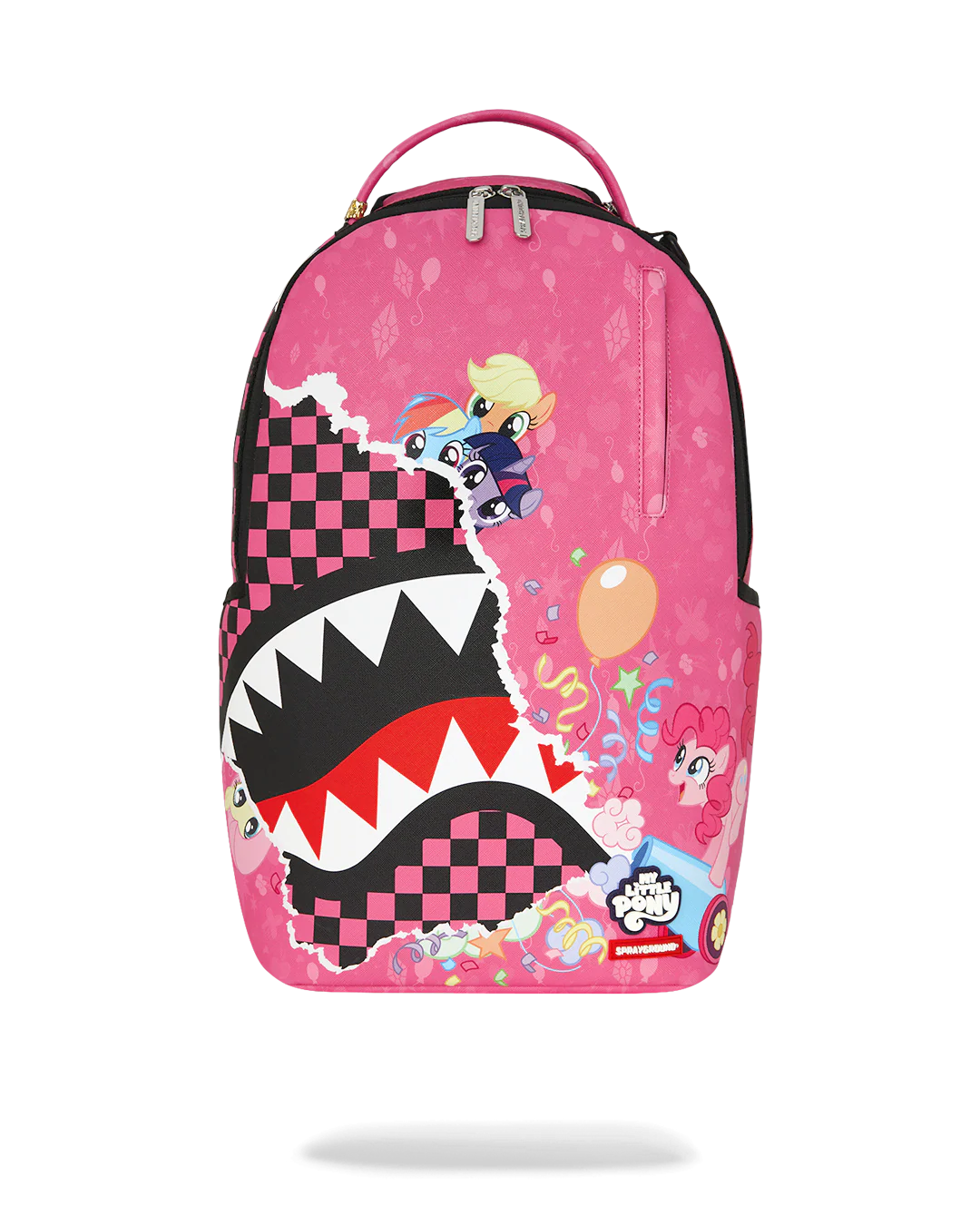 A pink backpack featuring a large cartoon shark mouth graphic with black and white checkered patterns, a character riding a blue scooter, and a small pink character illustration, shown on a white background.