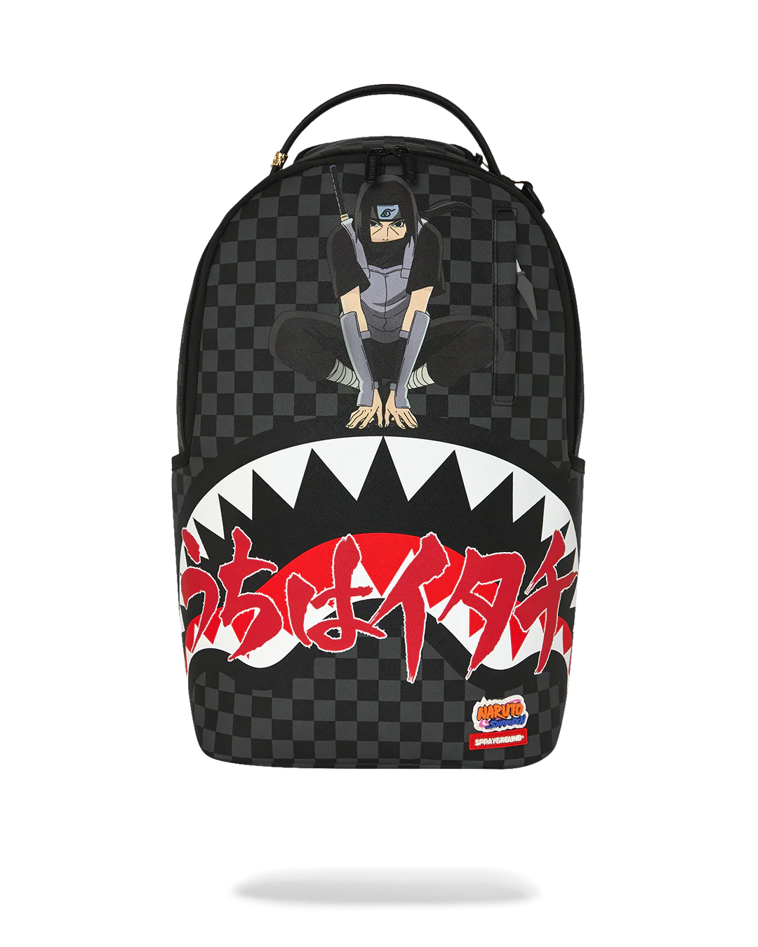 A black and dark gray checkered backpack featuring a graphic of a ninja sitting on the upper front, a large white shark mouth with red Japanese text across the lower half, and a small Sprayground logo patch near the bottom right.