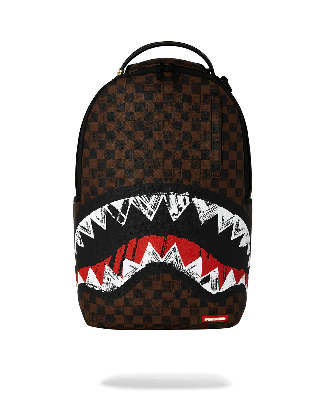 A Sprayground shark-mouth backpack featuring a brown and black checkered pattern, with a large graphic of white and red shark teeth across the lower front.