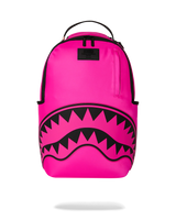 Bright pink backpack with a black shark-mouth graphic on the front and a top carry handle, shown on a white background.