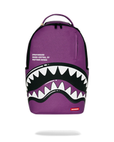 Purple backpack with shark mouth design and Sprayground logo on a white background