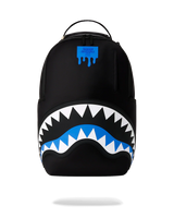 A black backpack featuring a large shark mouth graphic on the front, with white and blue details, and a blue dripping logo patch near the top.