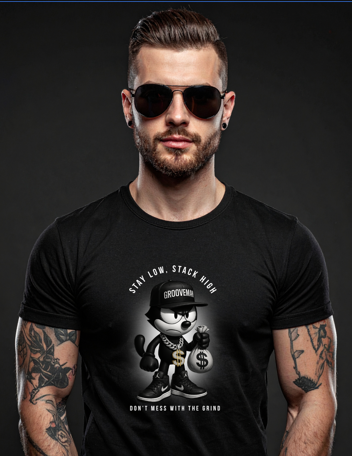 Man wearing a black t-shirt with a graphic design on a dark background