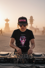 Black t-shirt with a cartoon character and text on a hanger against a dark background