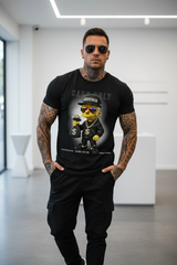 Black t-shirt with a cartoon character holding money on a hanger against a dark background