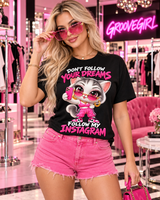 Blonde model wearing a black Follow My Instagram cat graphic T-shirt with pink sunglasses.