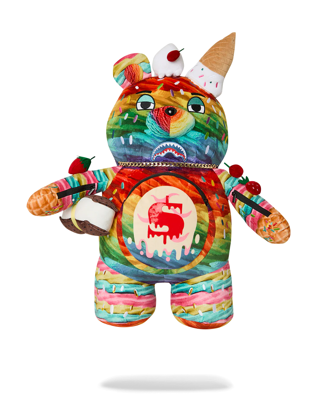 A colorful plush teddy bear toy with a vibrant graffiti-style painted pattern, featuring ice cream cone details on its head and arms, and a red apple graphic on its chest, shown against a plain white background.