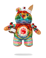 A colorful plush teddy bear toy with a vibrant graffiti-style painted pattern, featuring ice cream cone details on its head and arms, and a red apple graphic on its chest, shown against a plain white background.