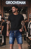 Black Island Distressed Denim Shorts – Paint Splatter & Chain Detail